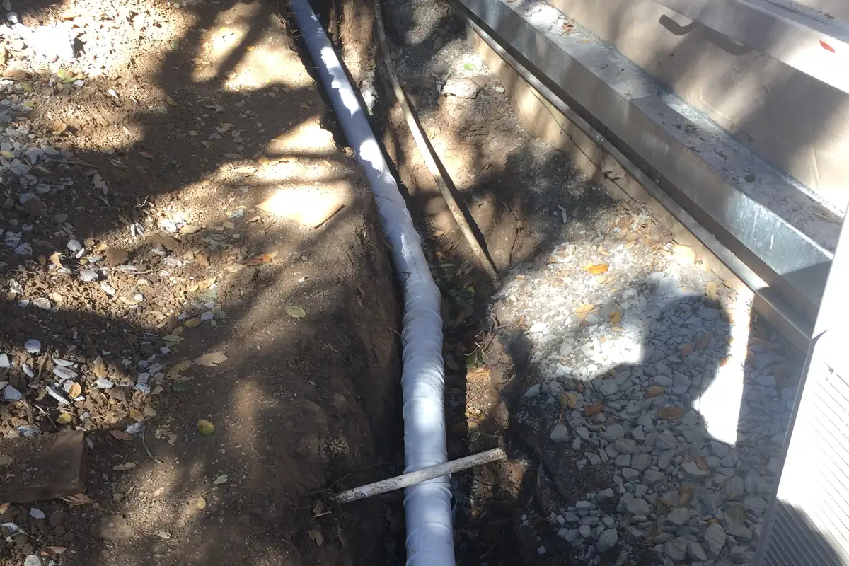 A new French drain installed to carry runoff away from the foundation.