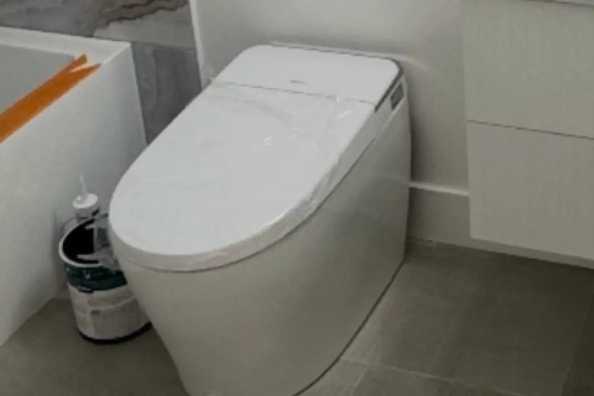 A new one-piece toilet installed and sealed in a remodeled Fairfield bathroom.